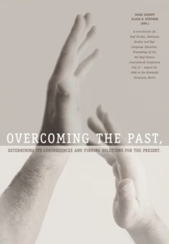 Two hands photographed in black and white on the cover of a book.